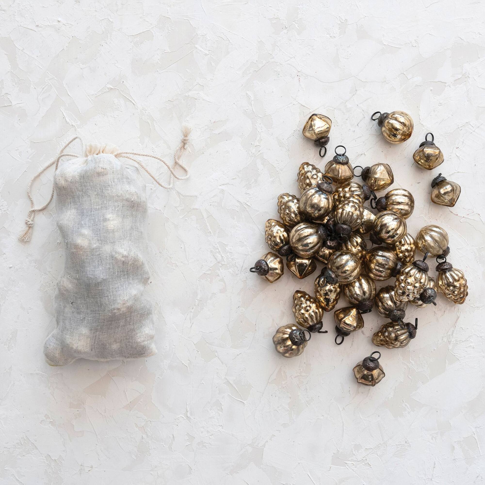 Hello Honey® 36 Pack 1" Antique Gold Mixed Shape Embossed Mercury Glass Ornaments